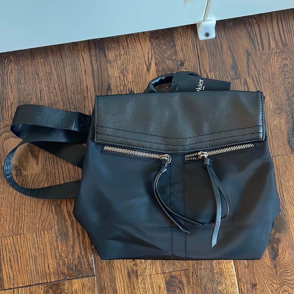 Botkier New York Mini Trigger Black Backpack with silver zipper detailing, vegan